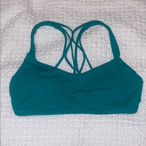 Bright teal Lululemon Free to Be sports bra